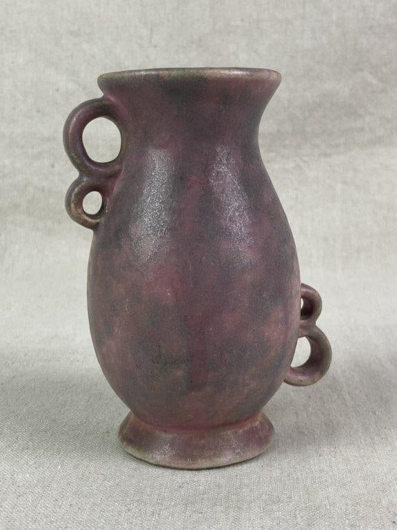 Stoneware Pottery Vase: A handcrafted stoneware pottery vase featuring a bulbous body with a small, flared rim and multiple looped handles, finished in a matte glaze with a marbled surface in shades of purple, pink, and