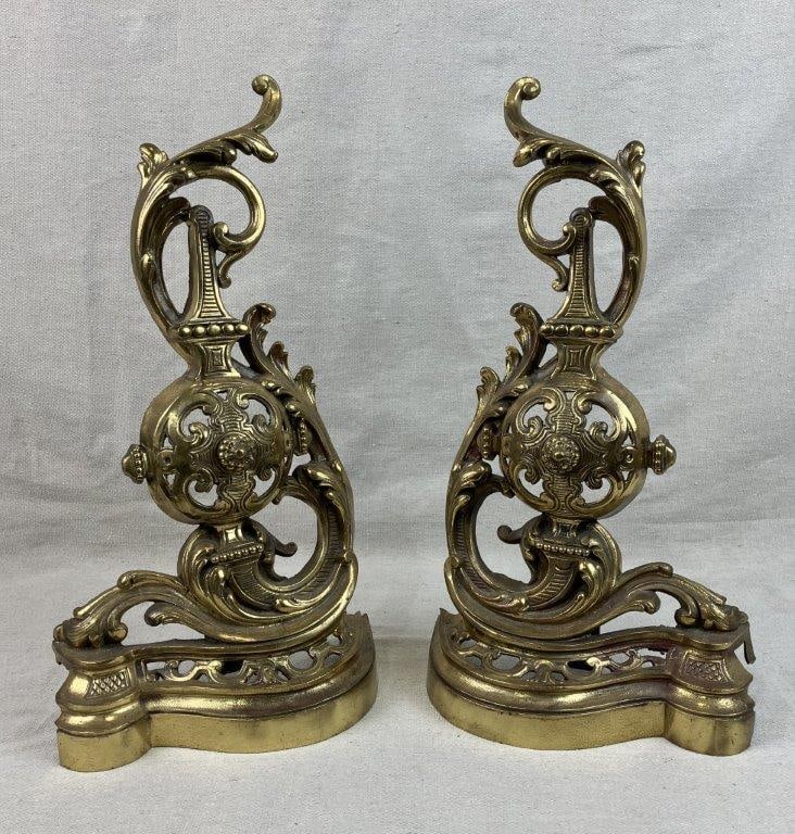Pair of French Baroque Style Chenets: Pair of French Baroque style chenets or andirons featuring decorative scrollwork and flowing curving lines with an architectural character typical of Baroque-inspired hearth furnishings. The cast