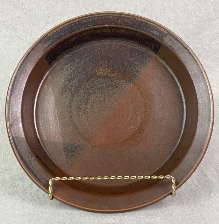Nancy Patterson Lamb Casserole Dish: An Iron Mountain Stoneware casserole dish designed by Nancy Patterson Lamb in the Roan Mountain pattern, finished in a semi-matte brown glaze with overlapping sections of dark speckled glaze and