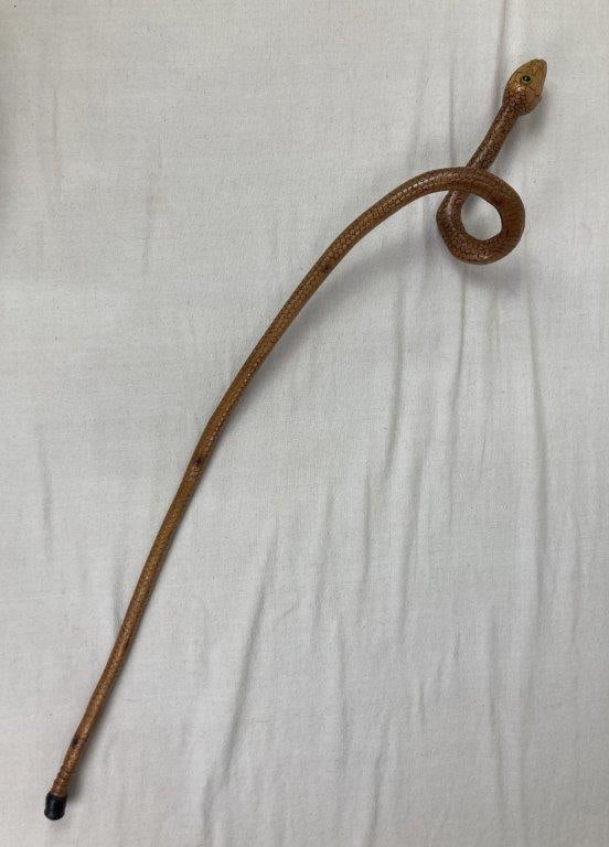 Folk Art Carved Snake Cane: A wonderful example of signed American folk art, incised with the initials "MDM" and dated '92. The cane features expertly carved details defining individual scales along a sinuous, curving shaft.
