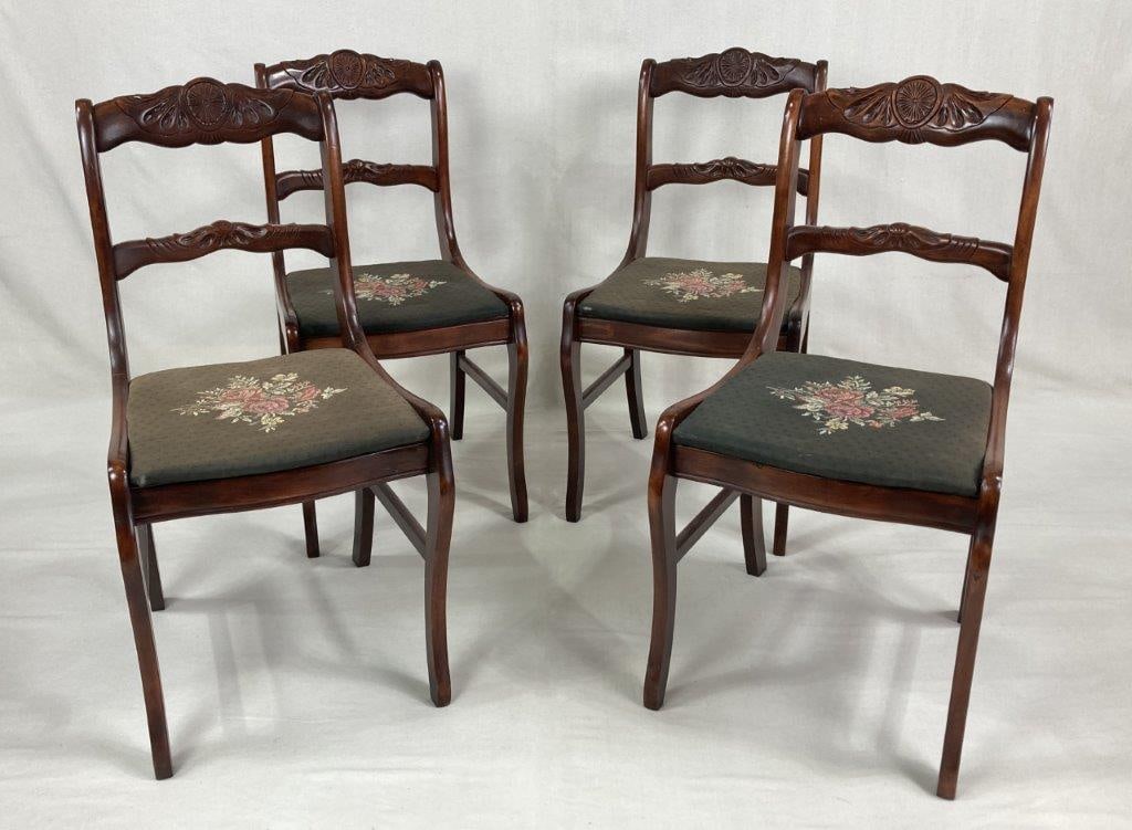 Sabre Leg Needlepoint Style Chairs: Each chair features an ornate splat with organic floral motifs and is upholstered in needlepoint style featuring intricately stitched rose designs. Measures approximately 33 1/2" H x 16 5/8" W x 16"