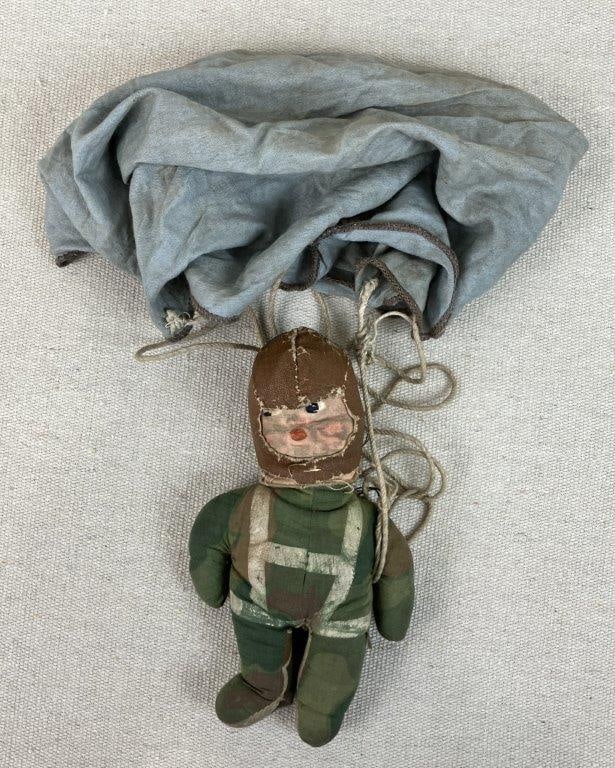 Raggy Doodle U.S. Parachute Doll, WWII Era: World War II era â€œRaggy Doodleâ€ U.S. Parachute trooper doll, a patriotic wartime toy design introduced in 1943. The figure features a camouflage fabric body,