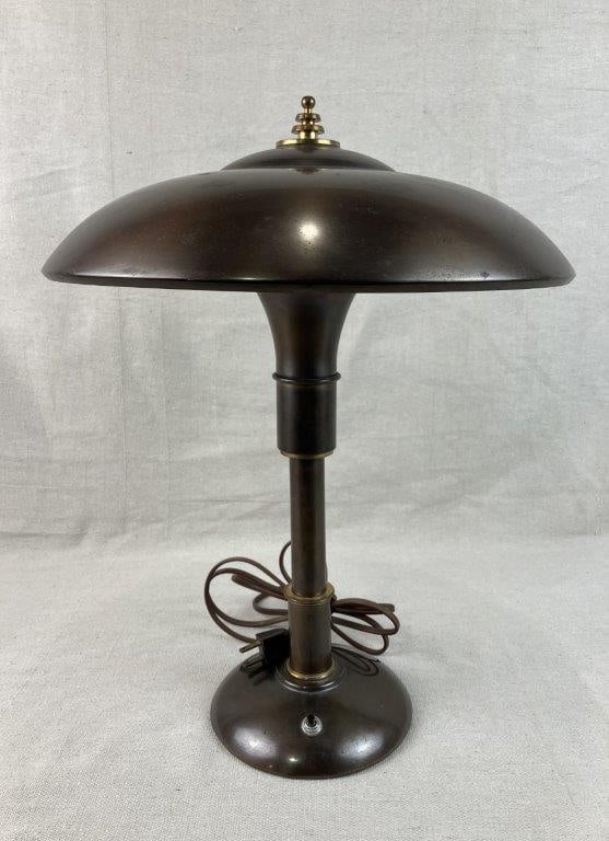 Art Deco Faries Guardsman Lamp: Circa 1930 desk lamp designed by Bert Dickerson for Faries, featuring the distinctive Normandy brass or copper-toned finish and characteristic Art Deco / Machine Age design. Measures approximately