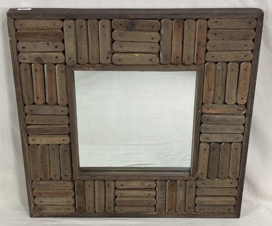Rustic Wood Wall Mirror: A square-form mirror featuring a frame constructed from reclaimed wood slats arranged in dynamic geometric patterned forms. The weathered wood provides a textured, organic aesthetic, blending