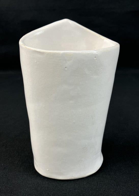 Theo Sable Pottery Vase: Organic form with handbuilt construction and soft white glaze, sculptural vessel intended for display. Signed Theo to the base. By New York artist Theodora Sable of Theo Designs