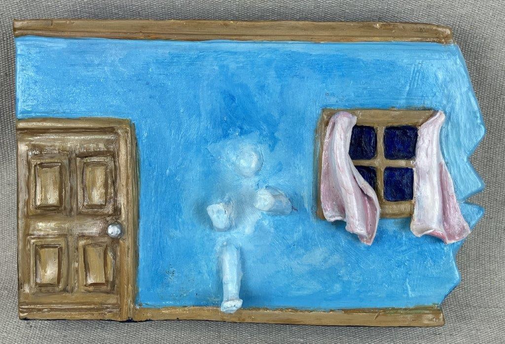 Surrealist Wall Diorama by Theo Sable: A surrealist, narrative wall sculpture depicting a ghostly, monochromatic figure emerging from a vibrant blue interior wall, framed by a paneled door and a window with draped fabric. Signed