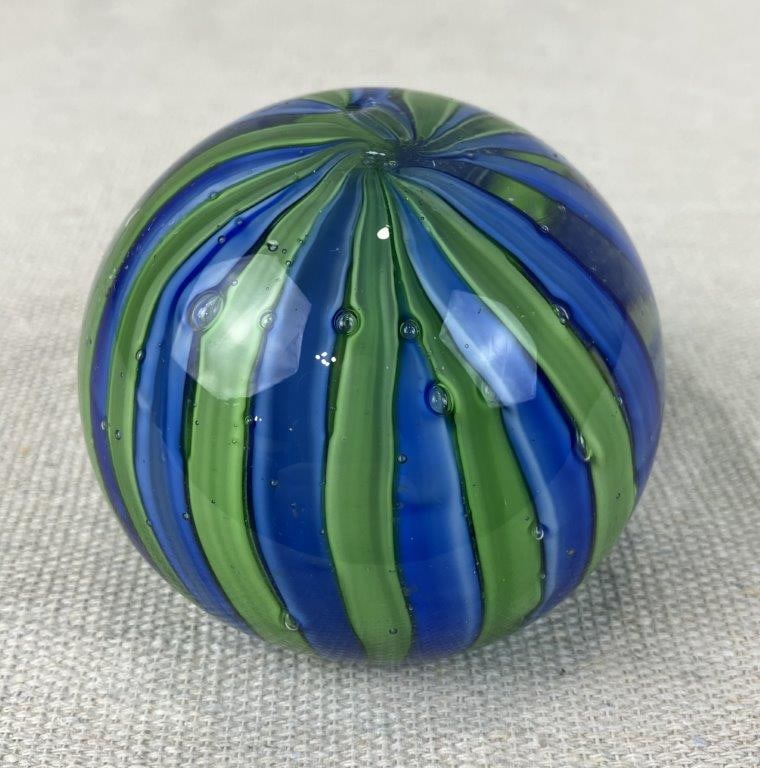 Swirl Art Glass Paperweight: Rounded paperweight with a green and blue swirl pattern in clear glass. Measures approximately 2 3/4â€³ diameter. Good condition. 