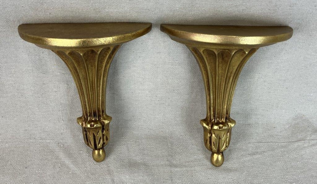 Pair of Neoclassical Style Gilt Shelves: Decorative bracket shelf pair featuring flared and fluted lines terminating in leafy vegetal forms in the neoclassical taste. One measures approximately 9 1/4â€³ H x