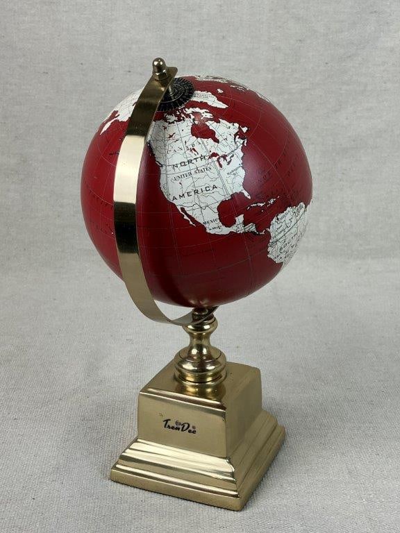 World Globe by Tren Dee: Decorative red globe mounted on a brass base. Measures approximately 10 5/8â€³ H x 5â€³ diameter including the base. Good condition.