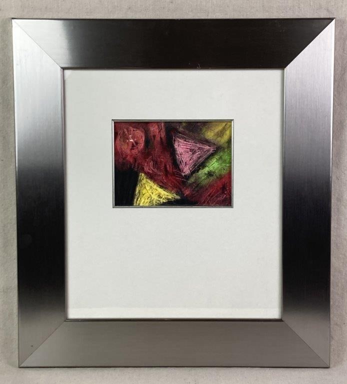 Abstract Oil Pastel Drawing: An oil pastel drawing on canvas board featuring geometric forms including a pink triangle and yellow triangle with a rush of red moving diagonally through the composition. Housed in a silver frame.