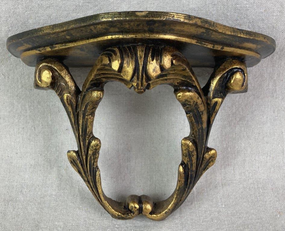 Vintage Giltwood Wall Shelf: Hand-carved wall shelf with a gold gilt finish in the Italian Florentine style, featuring intricate scrollwork and acanthus leaf motifs. Measures approximately 6 3/4â€³ H x