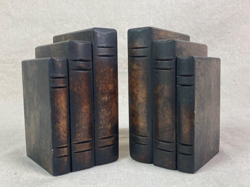 Alabaster Book Bookends: Italian-made and hand-carved alabaster bookends in the style of stacked books in graduated sizes, sticker on the bottoms say Genunine Alabaster Hand Carved Made in Italy and the other says 58315 Made