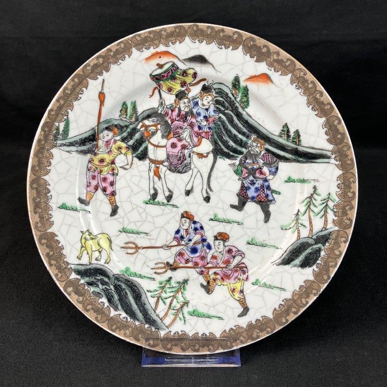 Chinese Warrior Motif Plate: Decorative plate depicting warriors in a lively arrangement with an enameled surface. Features a white ground with intentional crackle glaze and a Chinese mark on the underside. Measures