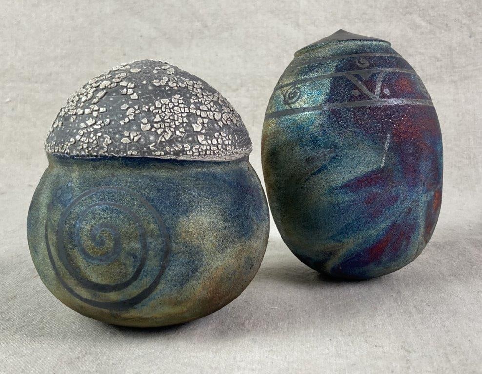 Raku Art Pottery Shakers: Hand-thrown pottery rattles with Raku firing, including an ovoid form with incised bands and a globular form with an incised spiral detail and crater-glaze top. The largest measures approximately 5