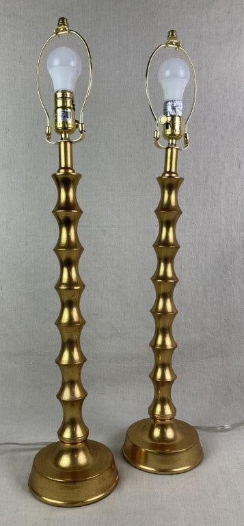 Pair of Gold Buffet Lamps: Tall buffet lamps with a slender profile and candlestick-style bases featuring a stacked design. One measures approximately 29â€³ H x 5 3/4â€³ W x 5