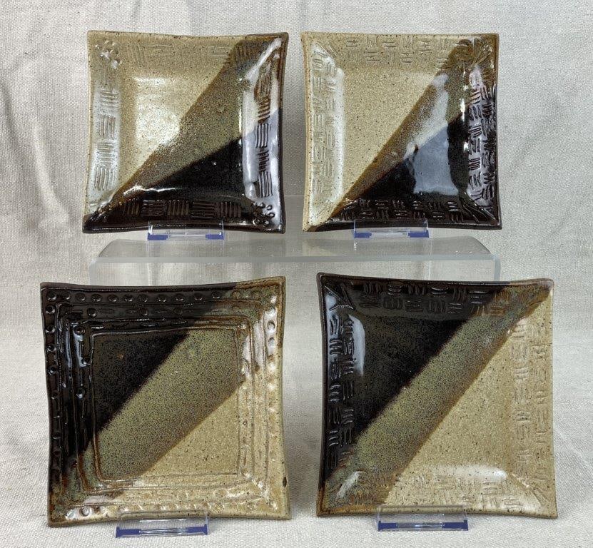 Four Studio Pottery Plates: Decorated with neutral brown and beige speckled glazes variegated through the dip-glazing method, with incised linear patterns along the edges. Each marked with an incised signature