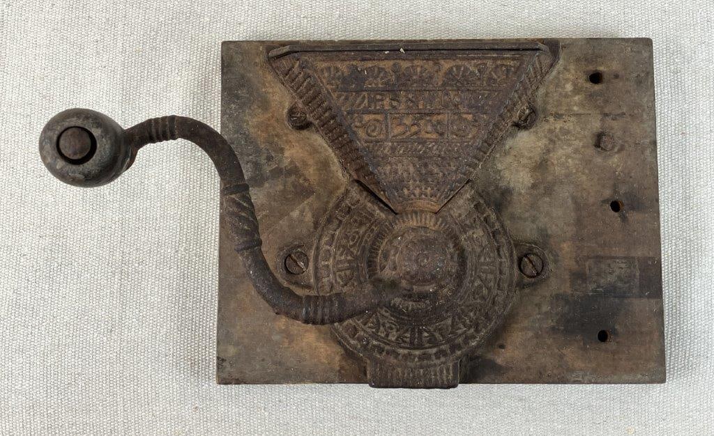 Peck, Stow, and Wilcox Coffee Grinder: Cast iron wall-mounted coffee grinder, model 3500, with hand-turned components. Measures approximately 7 7/8â€³ H x 9â€³ W x 6 3/8â€³ D.