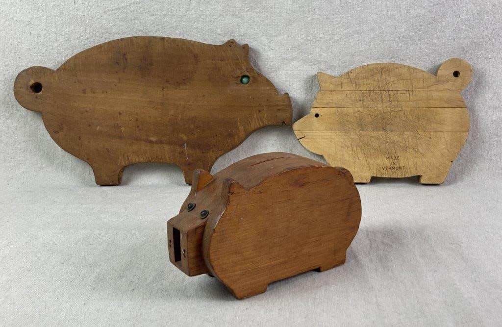 Wood Pig Board and Plaque with Still Bank: Group including a vintage wood pig board, a larger pig wall plaque, and a wood pig still bank. The smaller board has a lighter finish and is marked â€œMade in