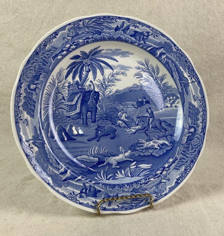 Spode Indian Sporting Transferware Plate: Transferware plate featuring a central landscape scene with hunters, dogs, and an elephant, surrounded by a floral border with animal motifs. The reverse reads: â€œThe Engravers'