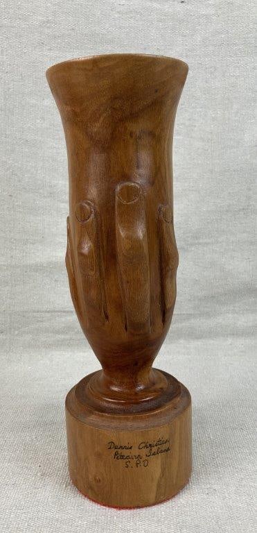 Pitcairn Island Folk Art Carved Vase: Turned and carved wood vase with a soft honey-toned patina. Features an encircling relief carving of a hand covering or holding the lower section, a design associated with the Pitcairn Island folk