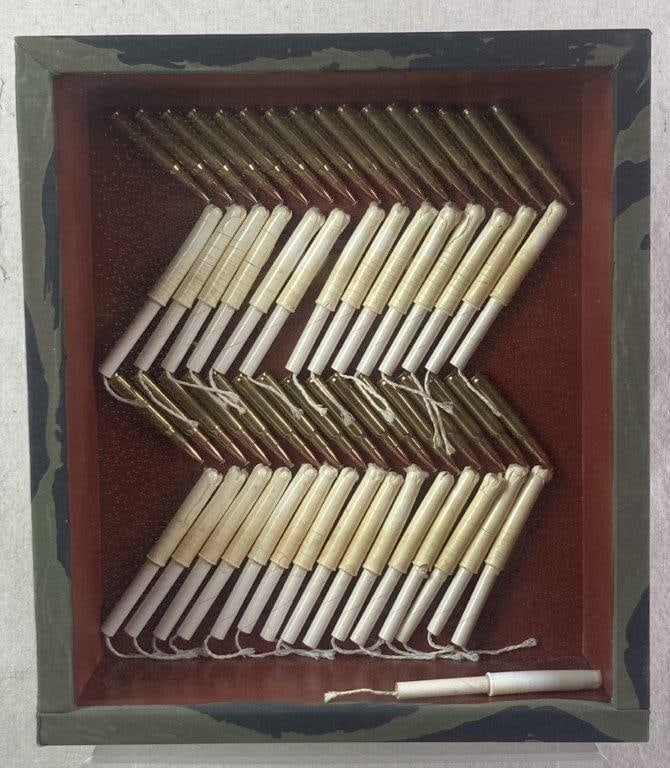 Bullets Mixed Media Sculpture by Theo Sable: A compelling mixed media composition from the 1960s featuring a repeating diagonal pattern of bullets and tampons. Theodora "Theo" Sable was a prominent New York artist and designer who taught at