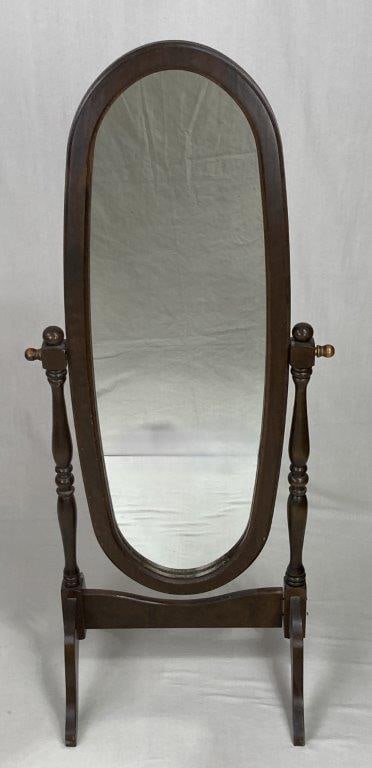 Cheval Full-length Mirror: A classic full-length standing mirror featuring an oval frame suspended between two elegantly turned supports. Crafted by Hortonville Rustics, this piece showcases a sturdy, traditional design with a