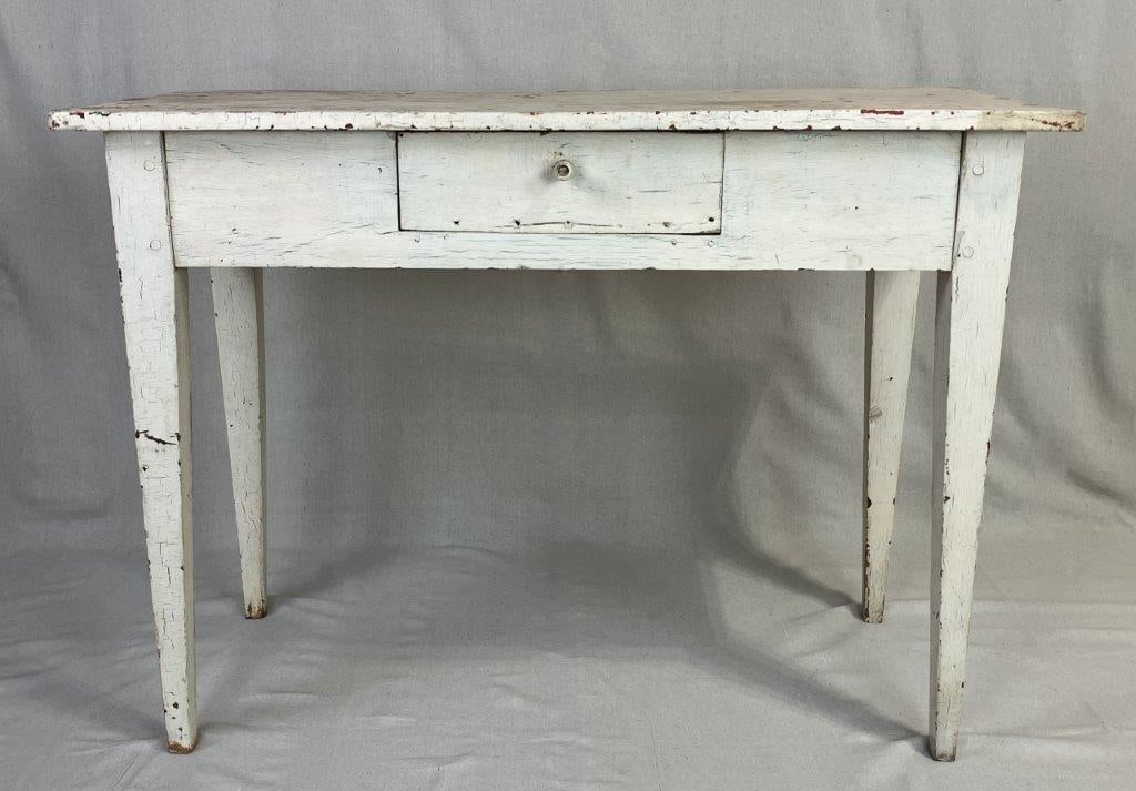 Painted Country One-Drawer Server: This versatile country server features a single wide drawer and is finished in a crisp white paint that highlights its simple, functional silhouette. Supported by four slightly tapered legs, the