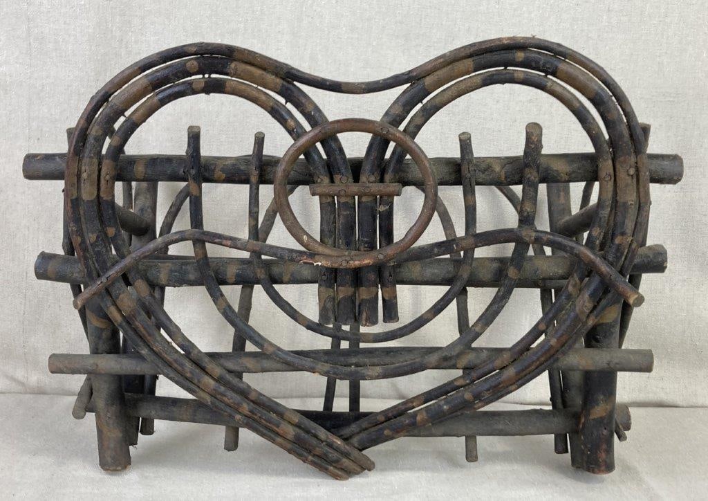 Adirondack Folk Art Wall Basket: Hand-bent willow branches secured with traditional nail construction, embodying the rugged elegance of Adirondack craftsmanship. The design features unique openwork double-arched heart motifs, adding