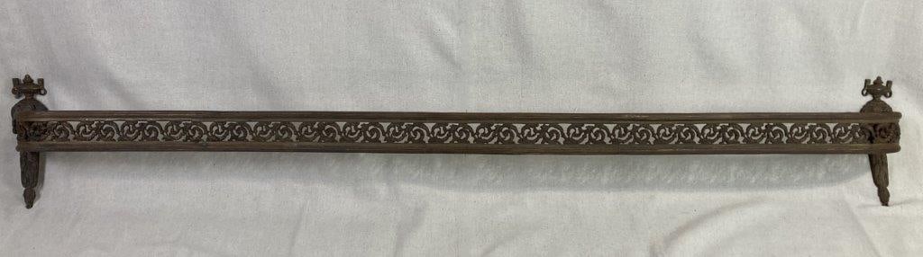 19th Century Brass Valance: A long rectangular form terminated by side brackets, showcasing the ornate metalwork characteristic of 19th-century interior design. The central frieze is exquisitely cast and pierced with a