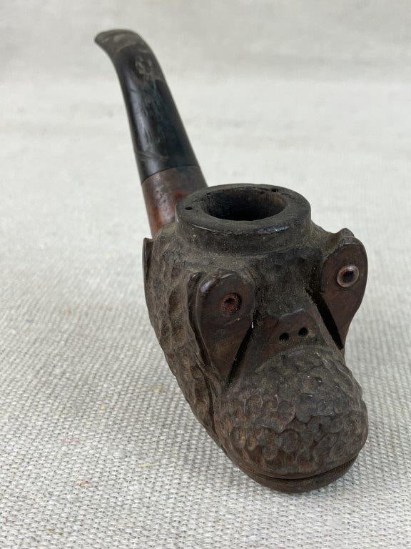 Italian Carved Monkey Head Figural Pipe: Figural pipe carved in the form of a monkey head with expressive sculptural features, the bowl integrated within the carved form. The shank is marked Made in Italy, indicating origin. The piece