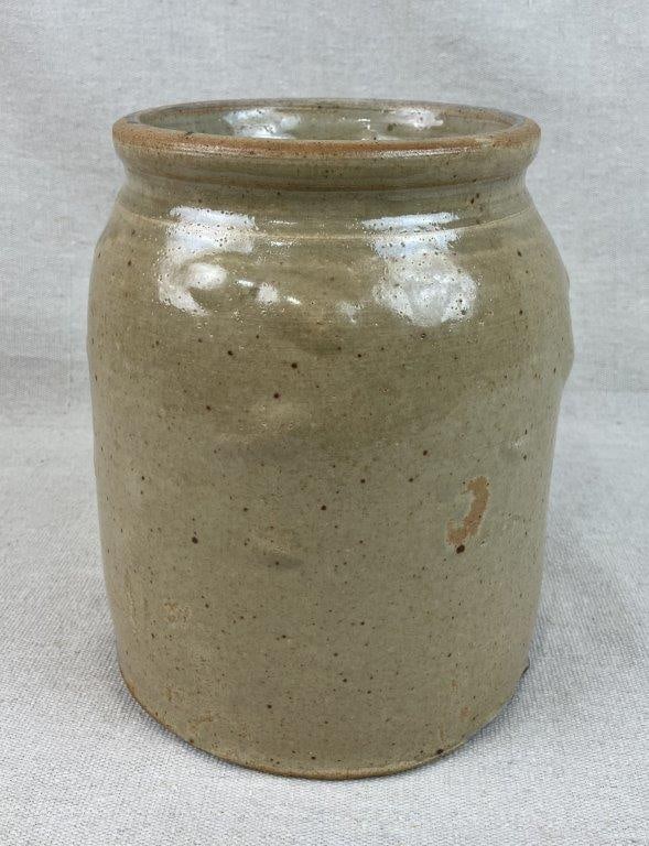 Glazed Stoneware Storage Jar: This cylindrical vessel features a curving shoulder accented by incised bands. It is finished in a distinctive soft speckled glaze characterized by unique glaze bumps and a runny effect. The jar