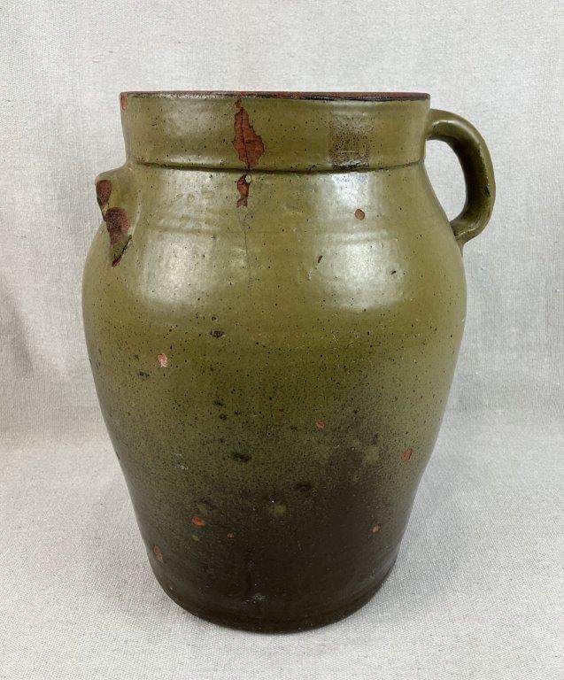 Upstate South Carolina Stoneware Storage Jar: Stoneware storage jar featuring a curving form with defined lip, impressed with a “3” denoting three gallon capacity. The vessel is fitted with one applied strap handle and one lug