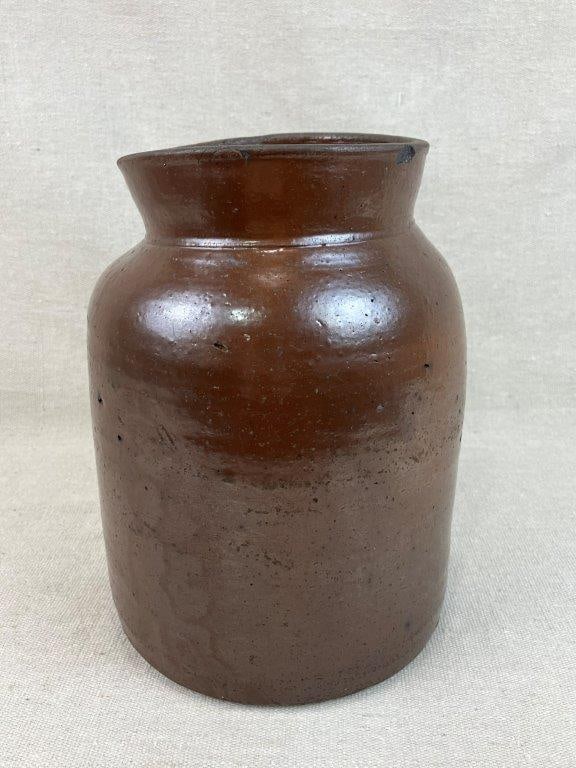 Albany Slip Stoneware Crock: This vessel features a cylindrical straight-sided form with a defined flared lip and is finished in a rich Albany slip glaze. The glaze exhibits beautiful color depth and natural pinholes inherent to