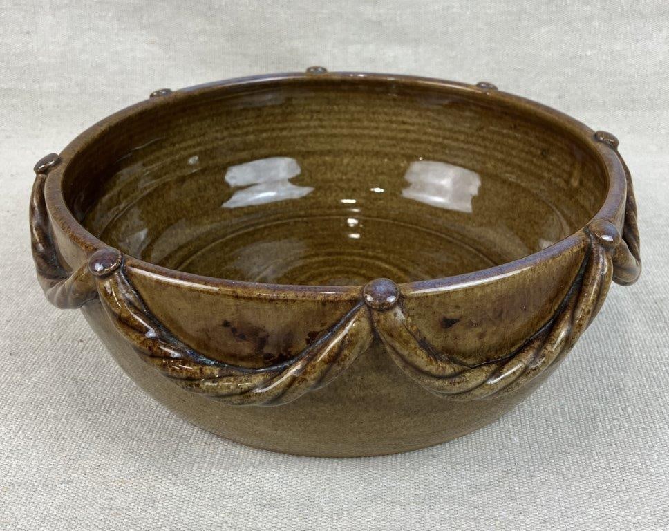 Otis Norris Studio Pottery Bowl: Sandhills Pottery, McBee, SC, 20th/21st Century. This vessel features an elegantly curving form accented by a signature applied decorative rope-like design. It was created by Otis Norris, a noted Sout