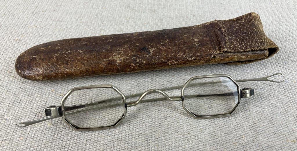 R.F. Welch Menâ€™s Spectacles and Leather Case, Late 19th to Early 20th Century: Pair of octagonal spectacles with metal frames housed in a fitted leather case, dating to the late 19th to early 20th century. The spectacles reflect period eyewear design with simple functional