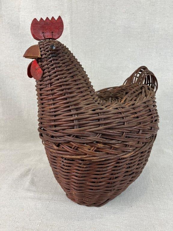 Woven Chicken Form Covered Basket: Charming woven covered basket in the form of a chicken, featuring handwoven construction with applied wooden details and lifelike eyes. The sculptural form combines functionality with decorative folk