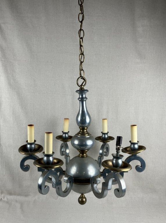 Mixed Metal Chandelier: Chandelier featuring six curving arms in a traditional form, constructed of mixed metals likely including pewter and brass. The design displays flowing lines with suspended chain for hanging.