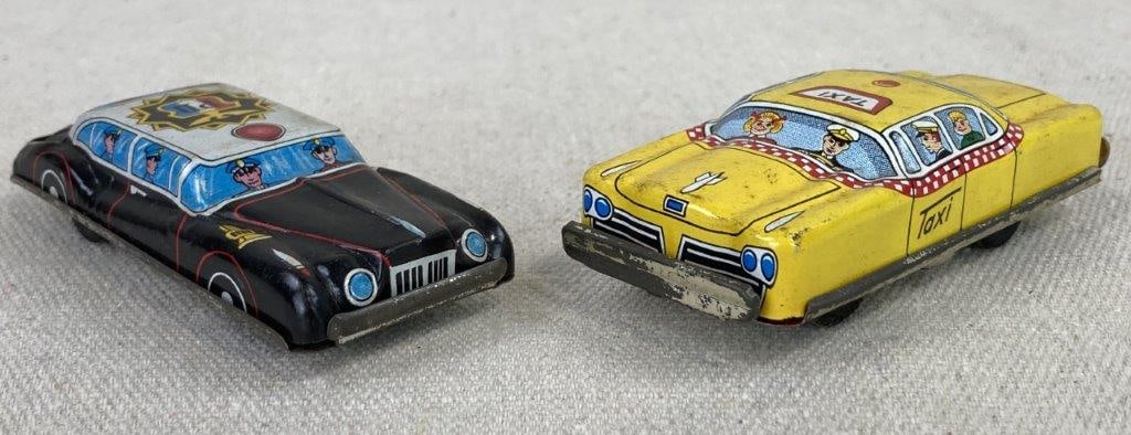 Tin Litho Toy Cars: This charming duo of mid-century tin toys showcases the vibrant lithography synonymous with Japanese toy manufacturing of the era. The set includes a bright yellow taxi by Toys Nomura, featuring a