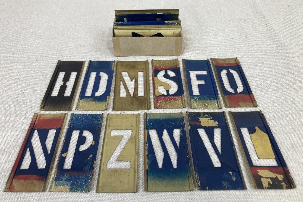 Brass Letter Stencils: Stencils crafted from durable brass and features a classic, industrial-style block font. The set includes a variety of letters and numbers, along with select punctuation marks, all characterized by a