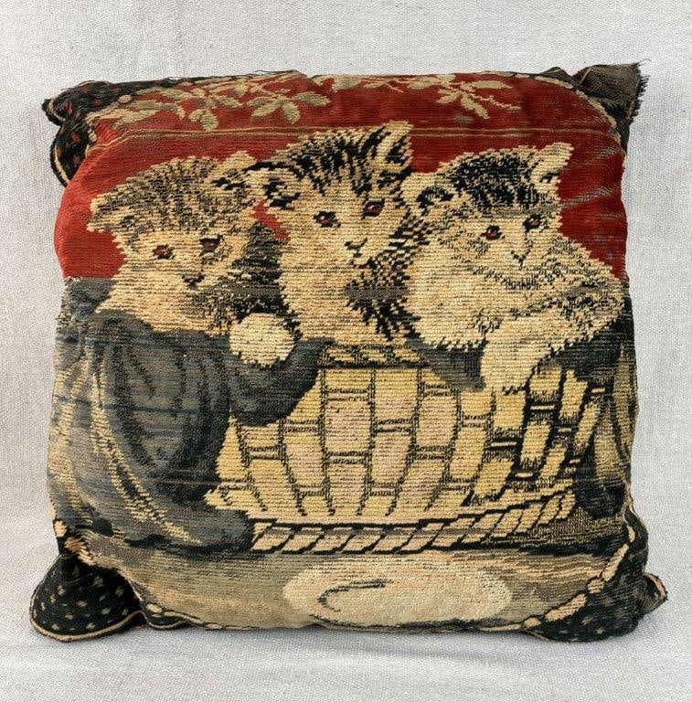 Cat Motif Tapestry Pillow: Decorative pillow featuring a tapestry-woven front depicting three cats gathered in a basket, with a complementary fabric backing. The woven design provides texture and visual interest, suitable for