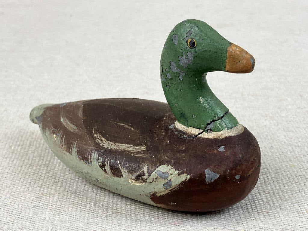 Small Polychromed Metal Duck Decoy: Small duck decoy in the form of a mallard, constructed of metal with carefully applied polychromed painted details. The compact form and painted surface give the piece a decorative and collectible