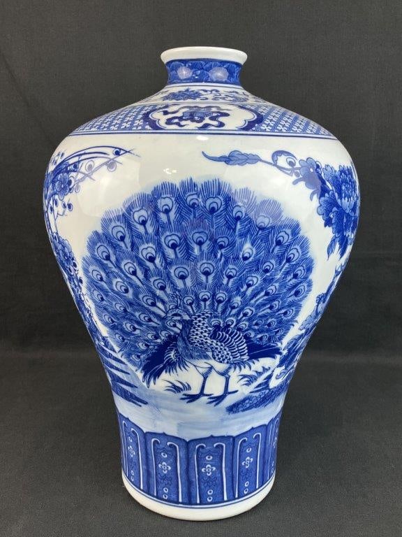 Chinese Blue and White Porcelain Vase with Peacock Motif: Porcelain vase in blue and white featuring a peacock motif in the Asian taste, rendered in cobalt blue against a white ground. The form displays an elegant curving profile with balanced proportions