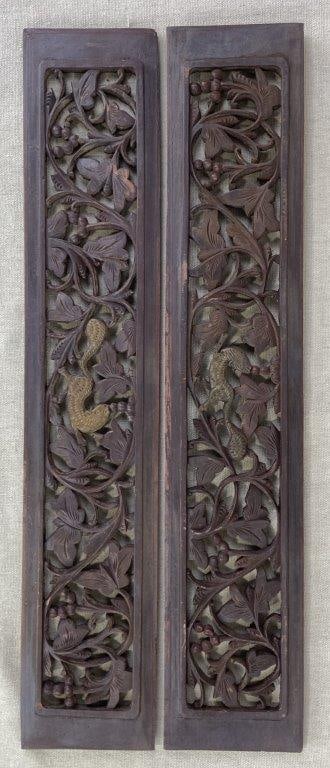 19th Century Carved Chinese Wood Panels: Exquisite hand-carved panels featuring intricate reticulated relief work finished in a deep dark tone. The central focus of each panel is a gilt-painted squirrel nestled within a lush surround of orna