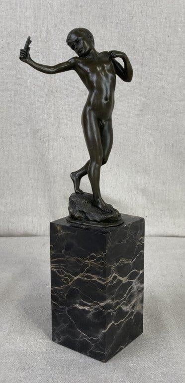 David with Sling Bronze Sculpture: A dynamic bronze figure depicting the biblical hero David in a focused, pre-battle stance as he prepares to use his slingshot. The sculpture is notable for its athletic detail and sense of movement,