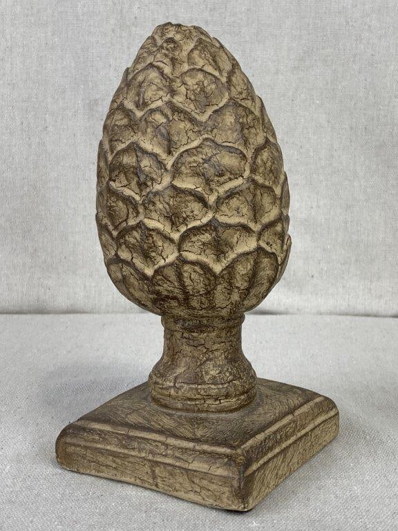 Artichoke Finial Statue: A classic decorative finial is crafted from durable magnesium oxide, sculpted into the detailed form of an artichoke. The statue features a heavily weathered brown finish that replicates the look of