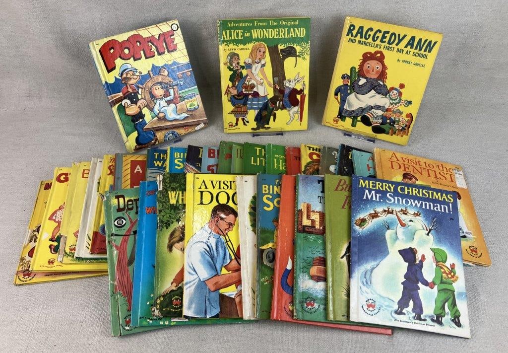 Thirty-One Childrens Wonder Books: Group of vintage childrens books including Popeye, Raggedy Ann, Alice and Wonderland, and more. One measures approximately 8 1/8" H x 6 1/2" W x 1/8" D. General wear with paper toning, spine wear,
