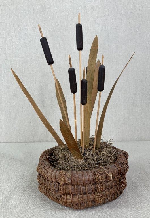 Folk Art Carved Wooden Cattails: A vintage botanical sculpture capturing the organic, naturalistic aesthetic of mid-century decor. The piece features six cylindrical hand-crafted "cattails" elevated on slender wooden rods, artfully i