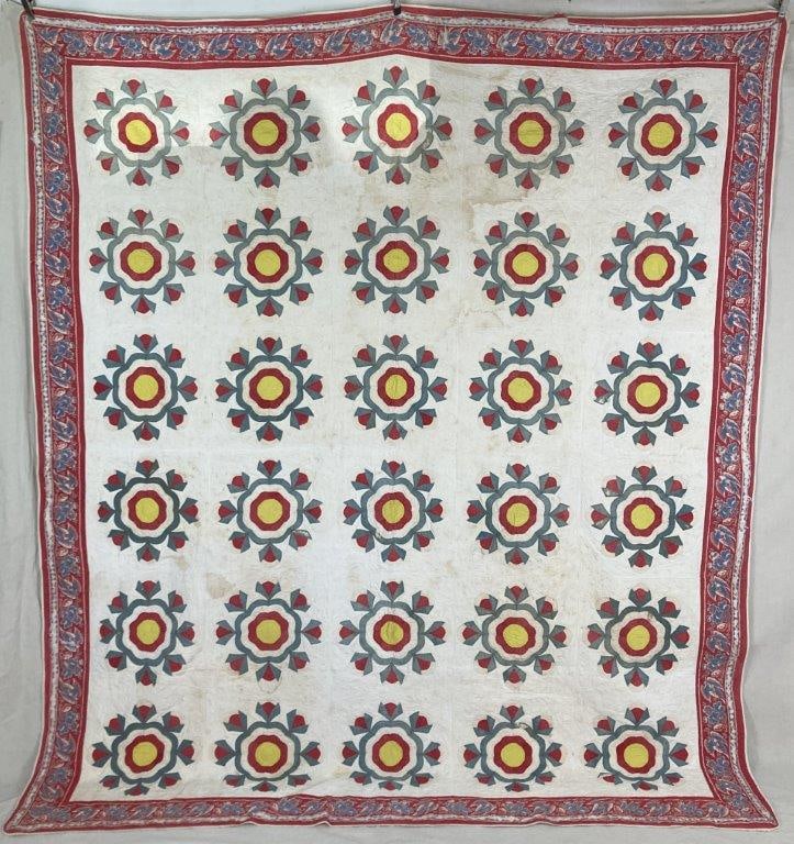 Rose Pattern Quilt: Quilt in a variation of the rose pattern, featuring a traditional hand-worked design with a soft textile character. Measures approximately 105â€³ H x 89 1/2â€³ W. Wear