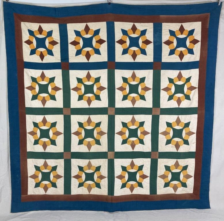 Star Pattern Quilt: Quilt in a vibrant color palette, composed in a traditional star pattern with hand-stitched construction and strong geometric design. Measures approximately 91 1/2â€³ H x