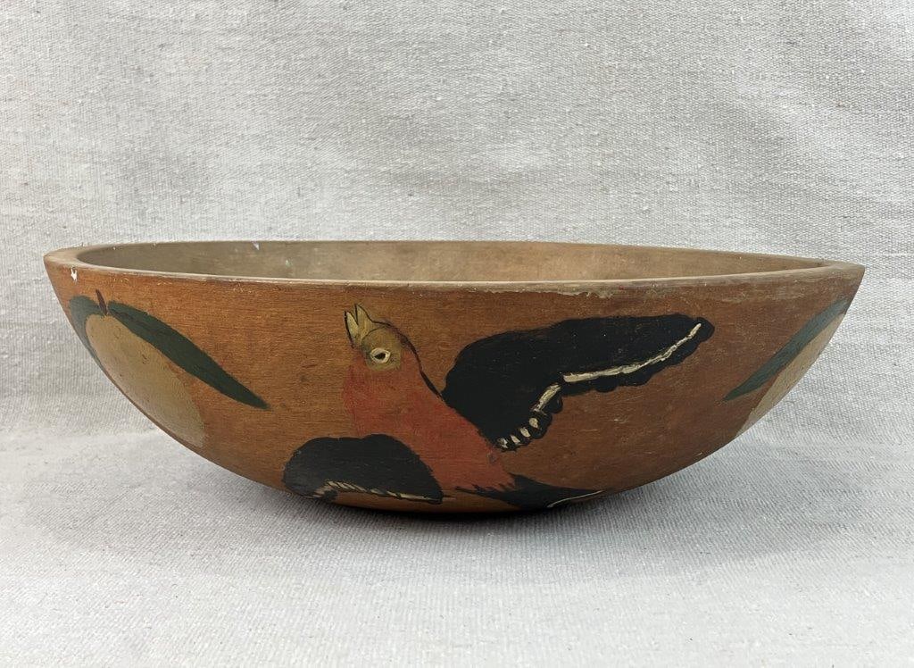 Polychromed Dough Bowl: Wooden dough bowl by Munising Woodenware Company, featuring painted bird and fruit decoration along the sides, with a turned form and rich aged patina. Measures approximately 3 3/4â€³